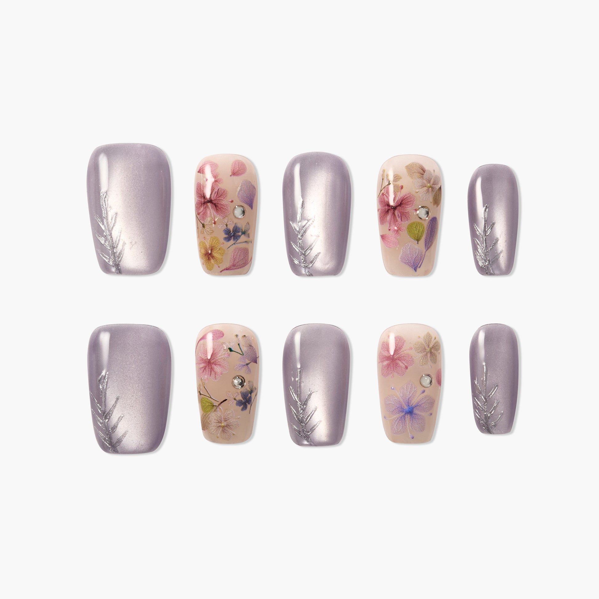 Handmade press-on nails with purple metallic polish, floral designs, and rhinestone accents