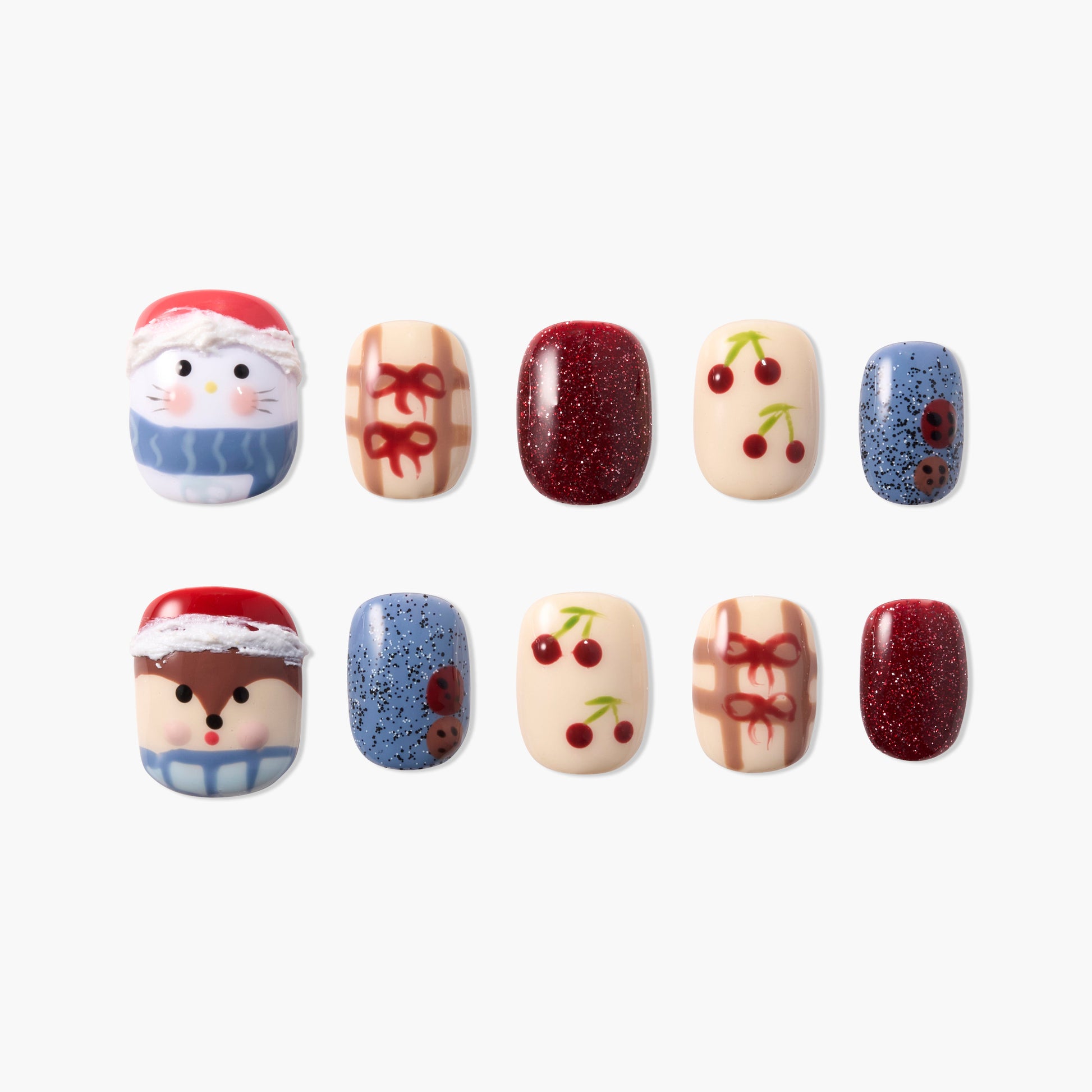 Handmade press-on nails set with holiday characters, cherries, bows, and glitter designs