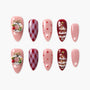 Christmas press-on nails set with pink, red, glitter, plaid, wreath, and tree designs