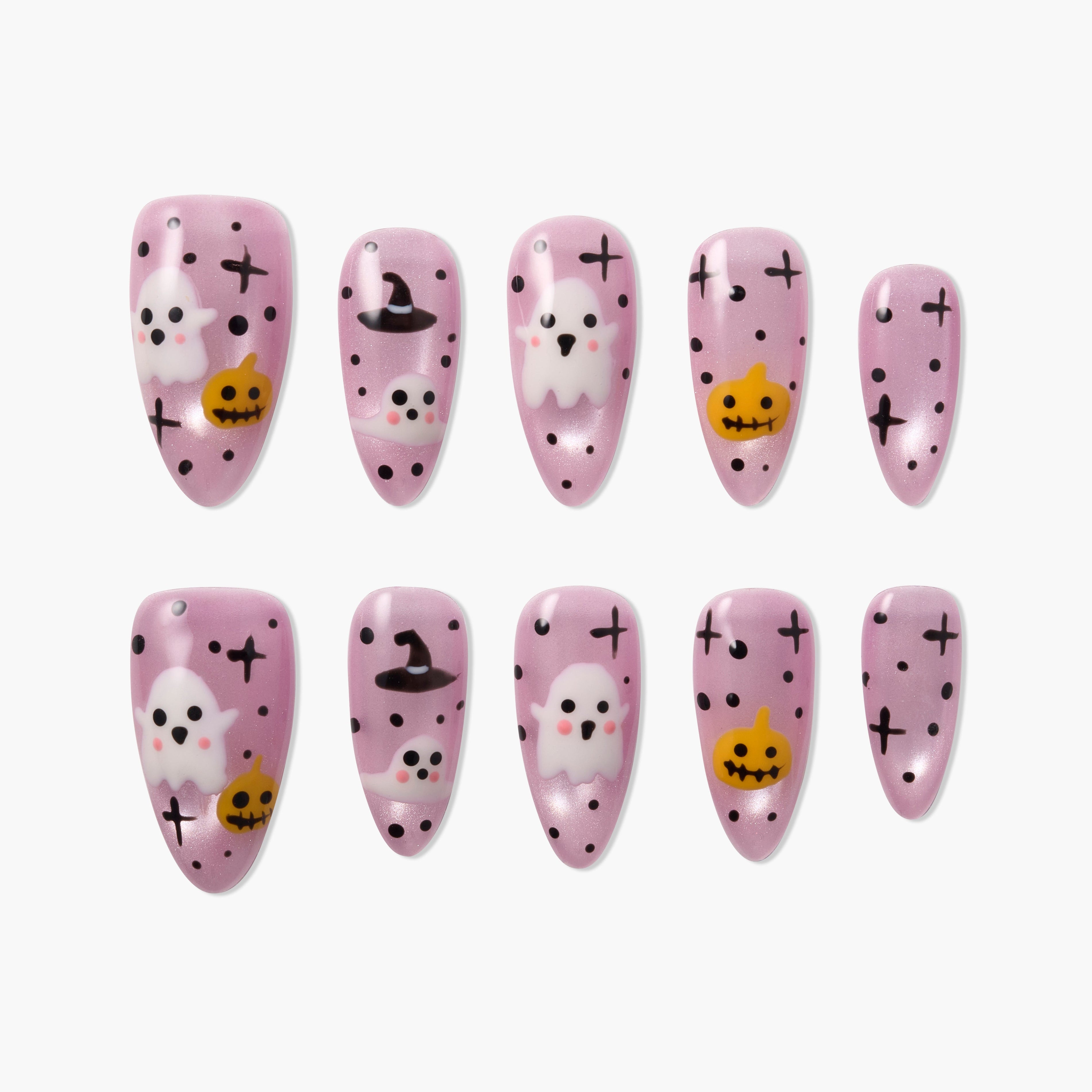 Pink Halloween press-on nails featuring ghosts, pumpkins, witch hats, and black dots