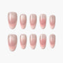 Set of glossy pink ombre press-on nails arranged on a white background