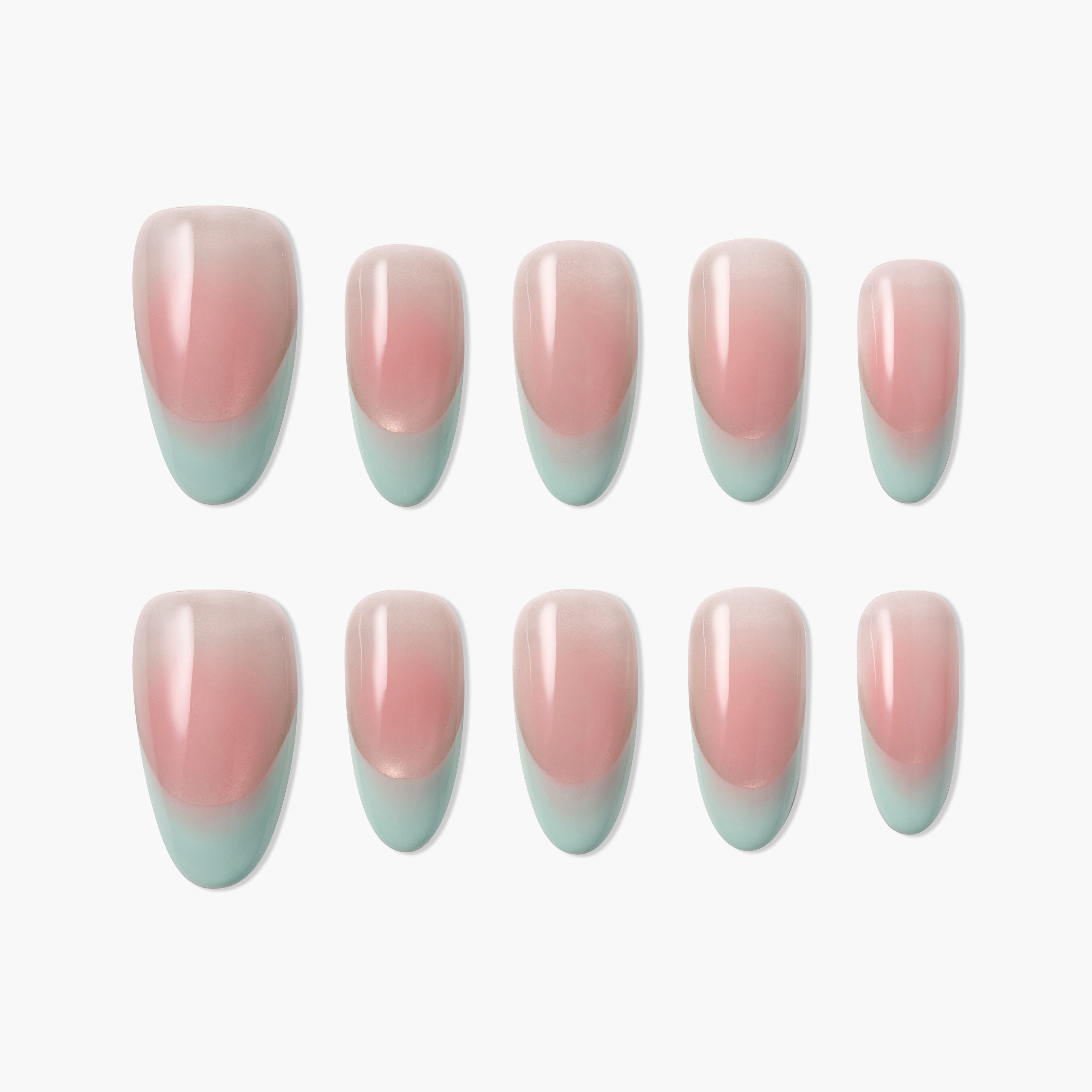 Set of pink and teal ombre press-on nails arranged on a white background