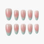 Set of pink and teal ombre press-on nails arranged on a white background