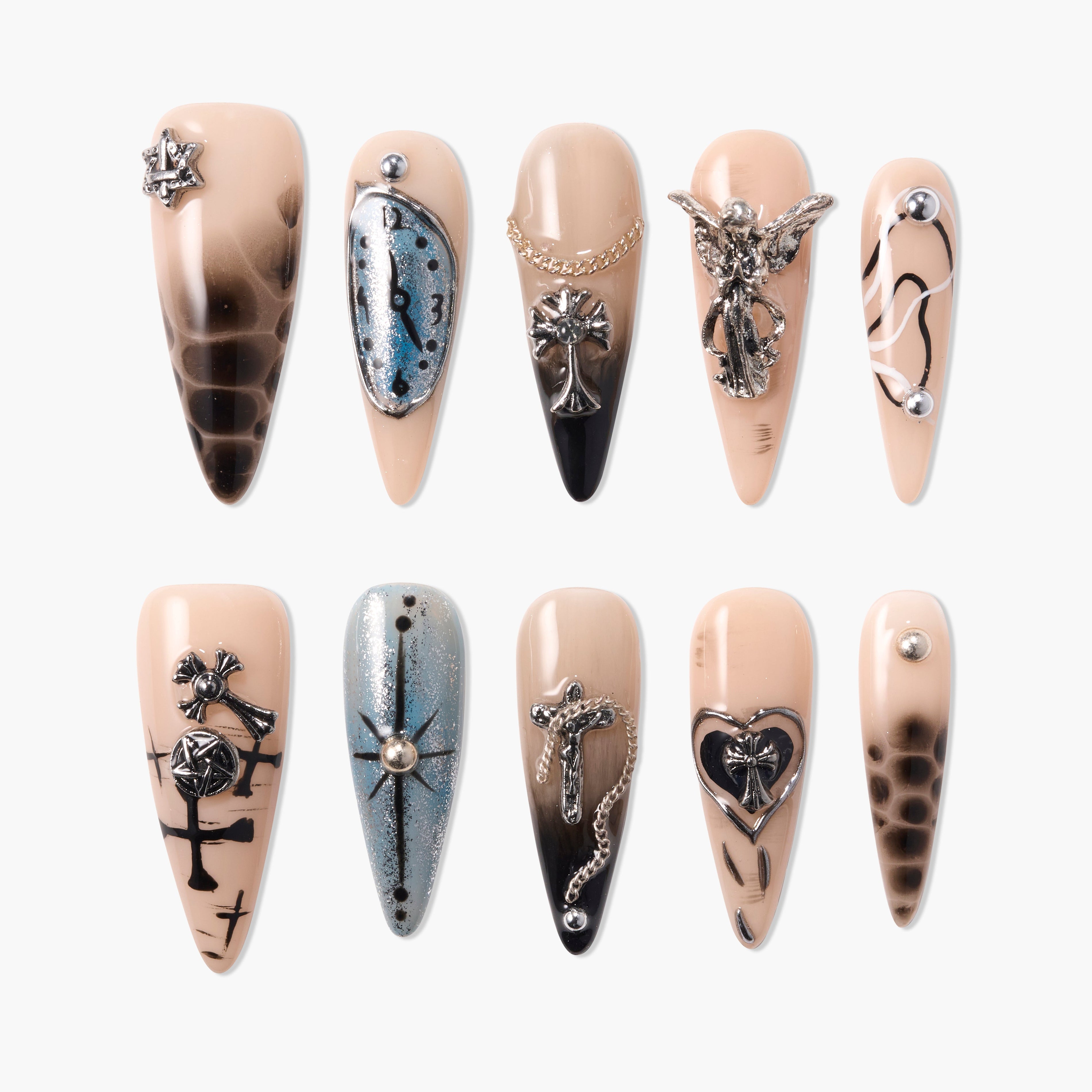Handmade press-on nails with nude and black ombre, metallic silver charms, and gothic designs.
