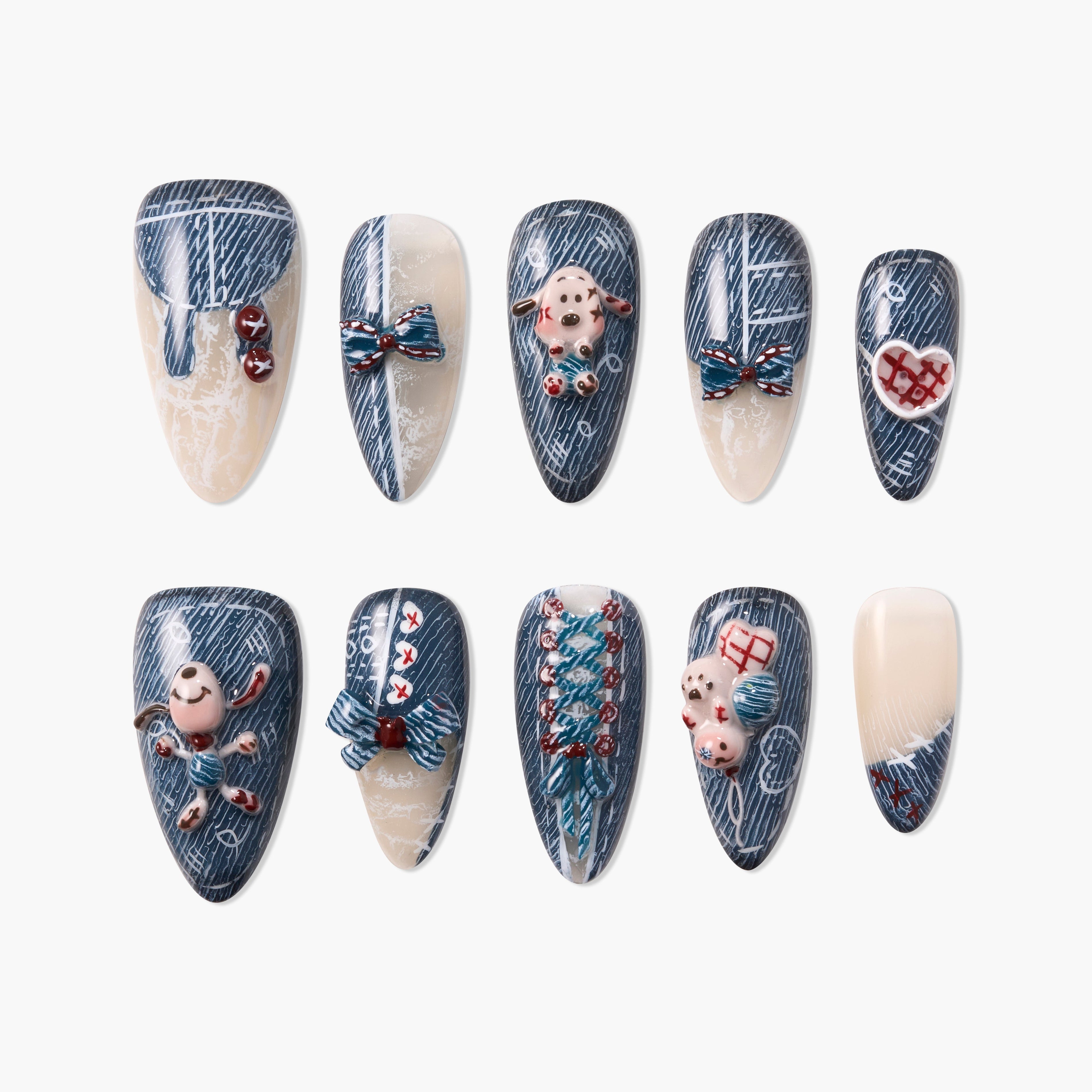 Handmade press-on nails with blue and cream patterns, 3D bows, teddy bears, and heart designs.