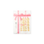 Toenail tool kit with nail file and toe separators in clear packaging tied with a pink ribbon