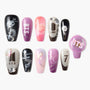 Handmade press-on nails set with BTS-themed purple, black, and pink designs, gemstone accents.