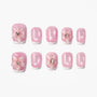 Pink French tip press-on nails with 3D floral designs and rhinestone accents