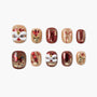 Handmade press-on nails with red and gold festive designs, lion heads, and 3D embellishments