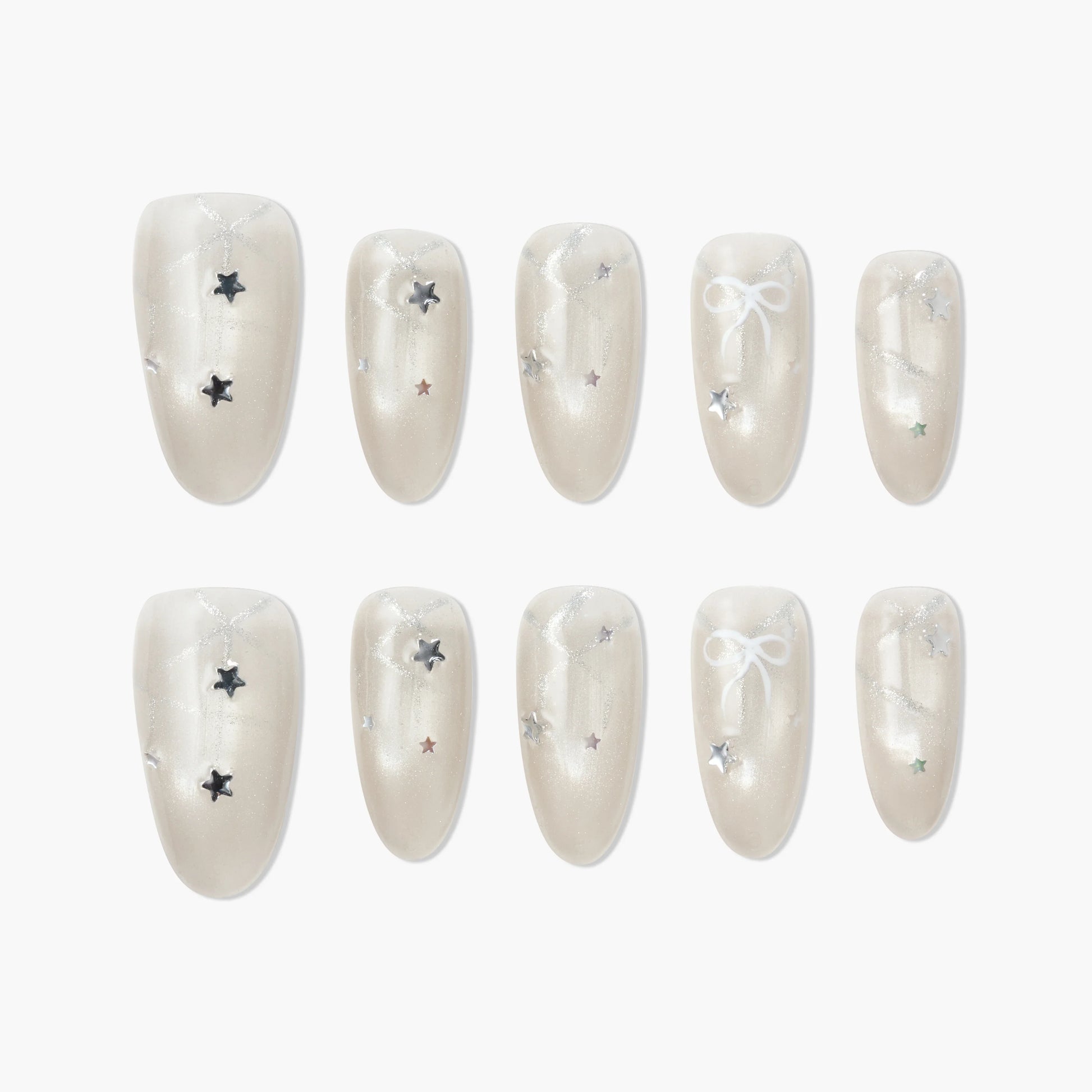 Pearl white press-on nails with silver glitter, star accents, and bow design, glossy finish