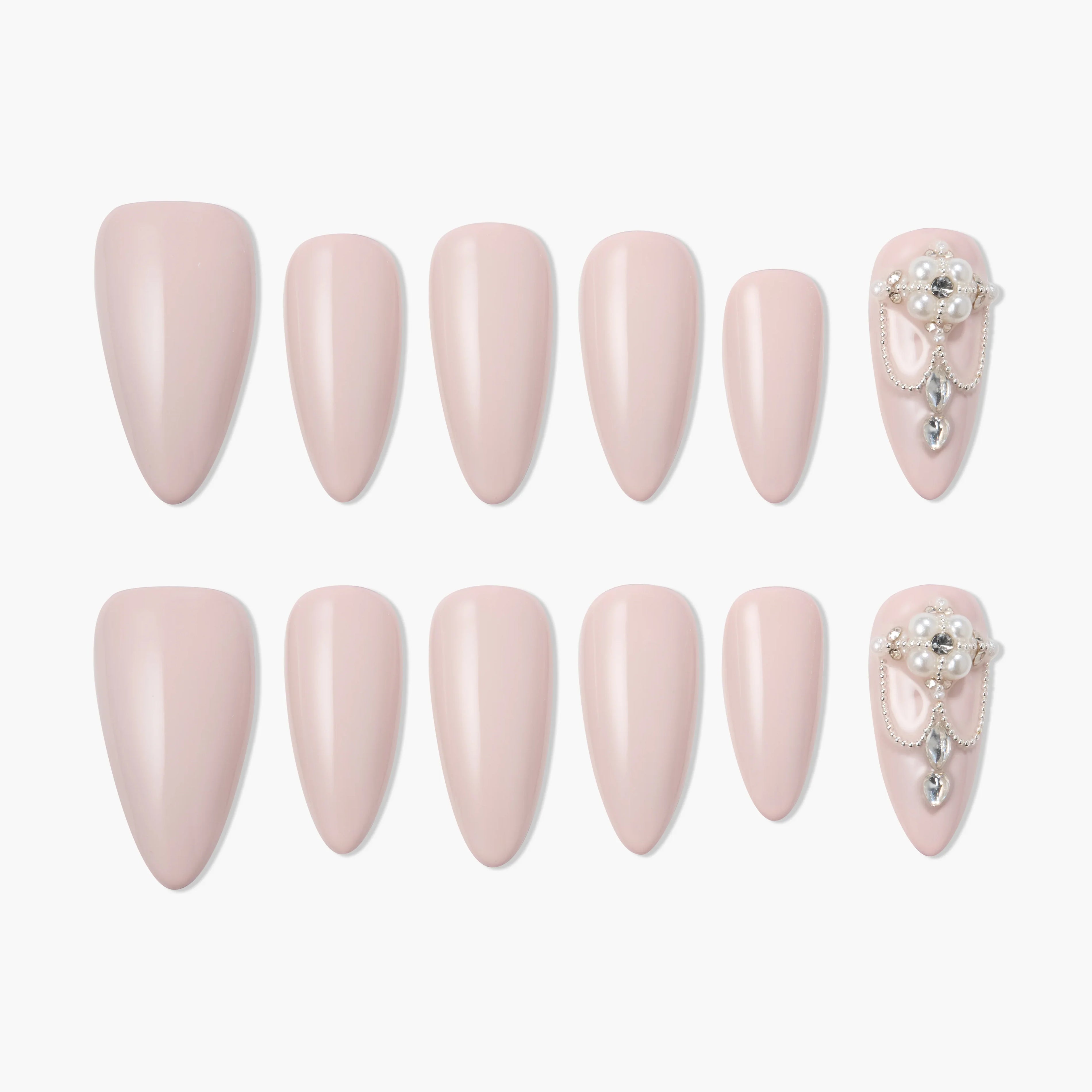 Set of pink almond-shaped press-on nails, with accent nails adorned with pearls and gems.