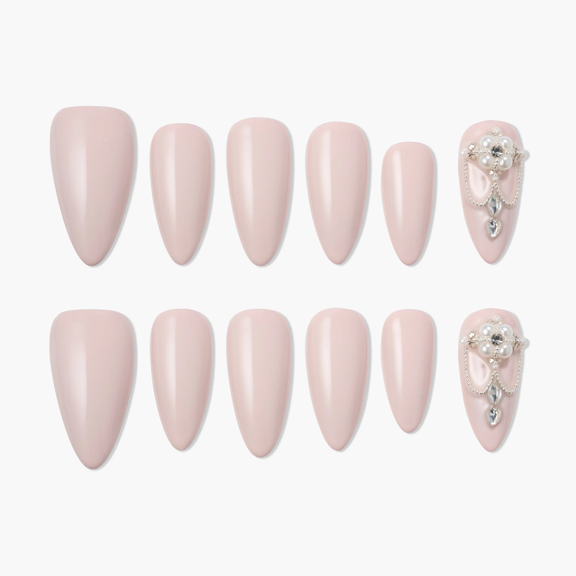 Set of pink almond-shaped press-on nails, with accent nails adorned with pearls and gems.