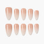 Set of nude ombre press-on nails in an almond shape, arranged on a white background.