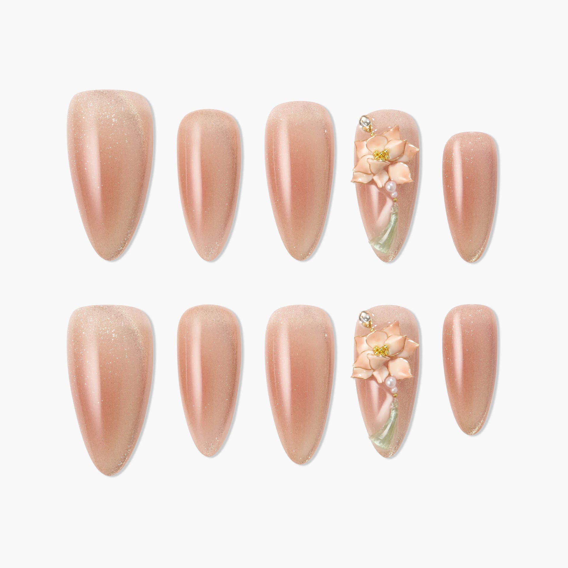 Handmade nude press-on nails with subtle shimmer and 3D floral accent design