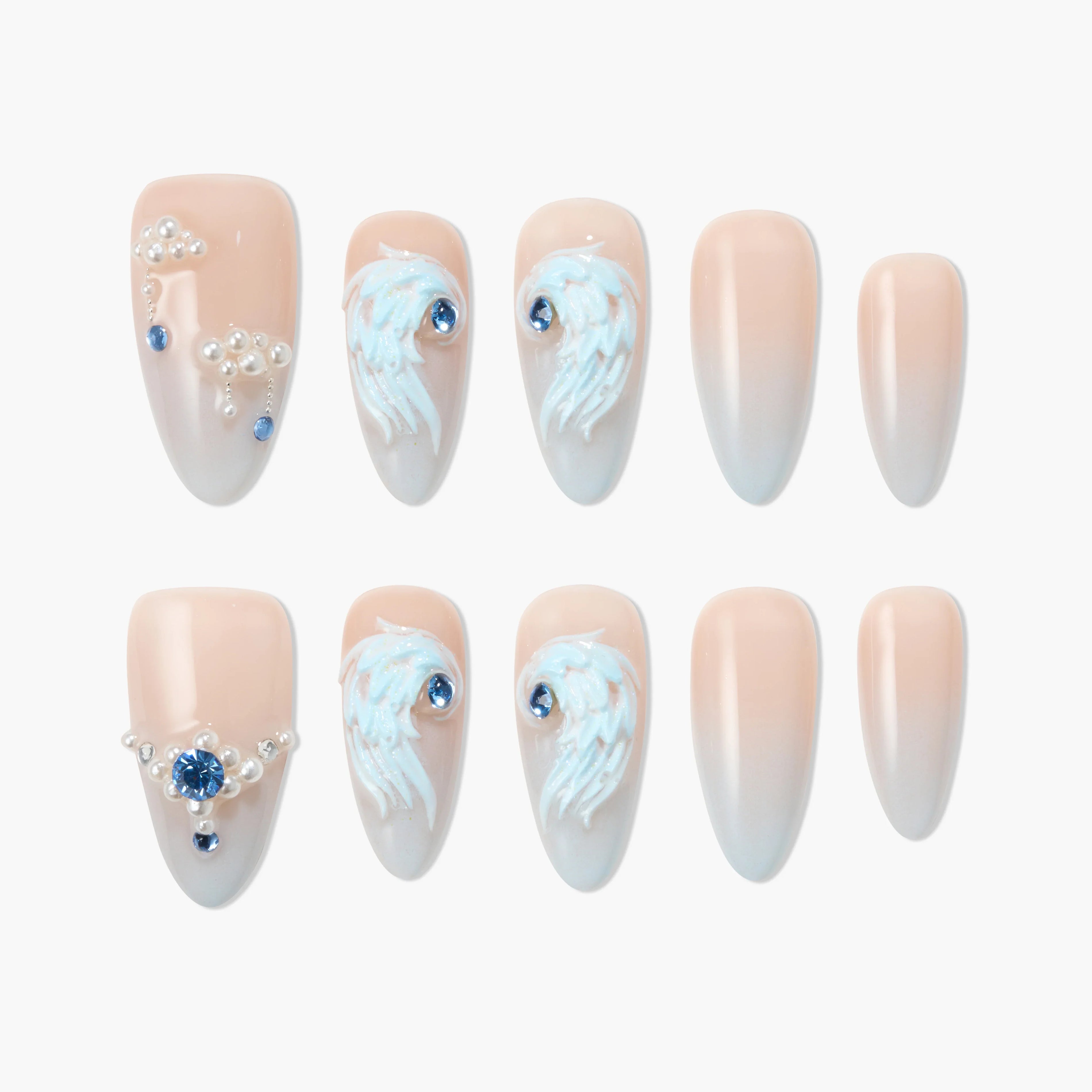 Handmade press-on nails with nude ombre finish, 3D pearl accents and blue gemstone details