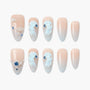 Handmade press-on nails with nude ombre finish, 3D pearl accents and blue gemstone details