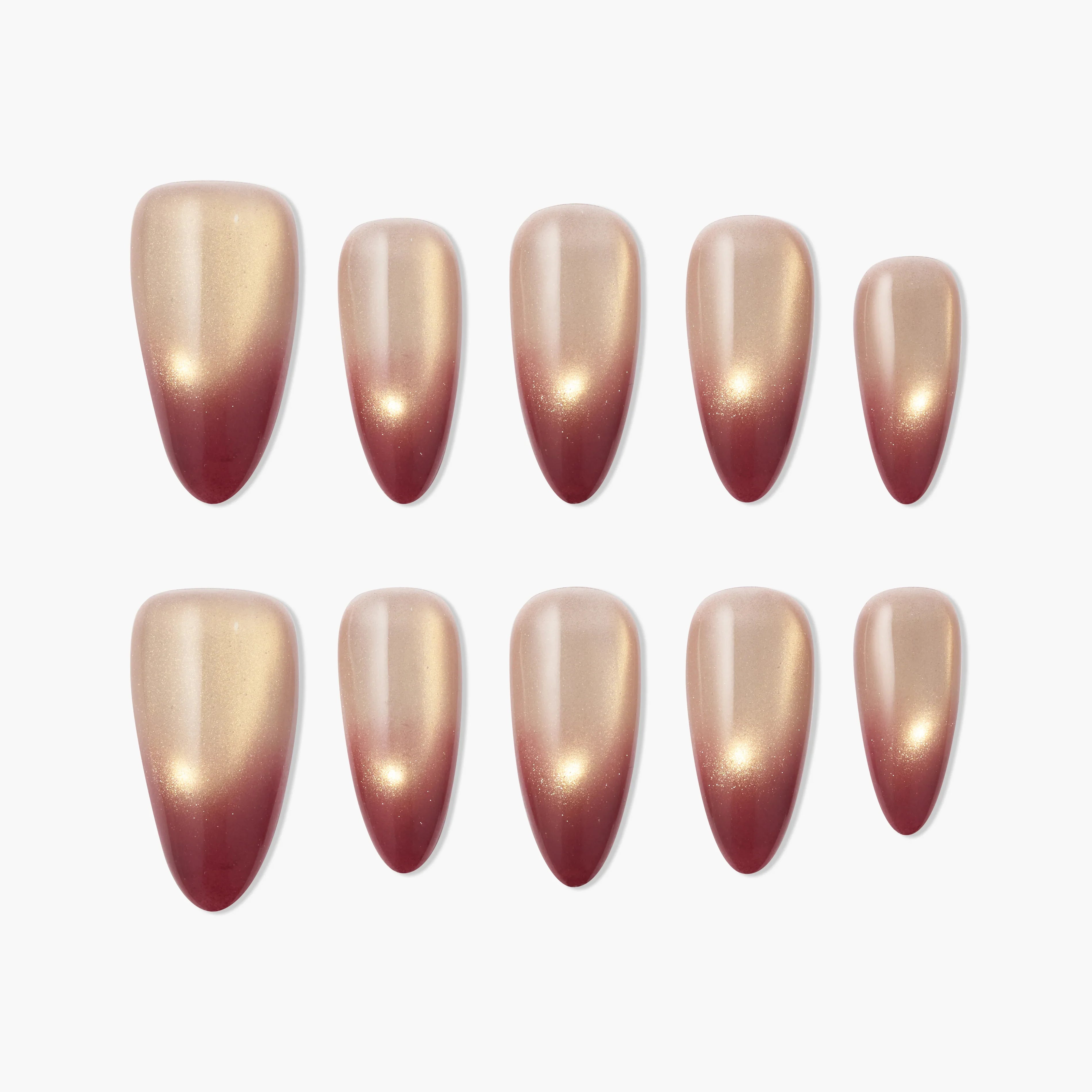 Set of ombre press-on nails with gold and burgundy gradient design on white background.