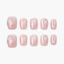 Handmade press-on toe nails with pink glitter and rhinestone accents, arranged on white background.