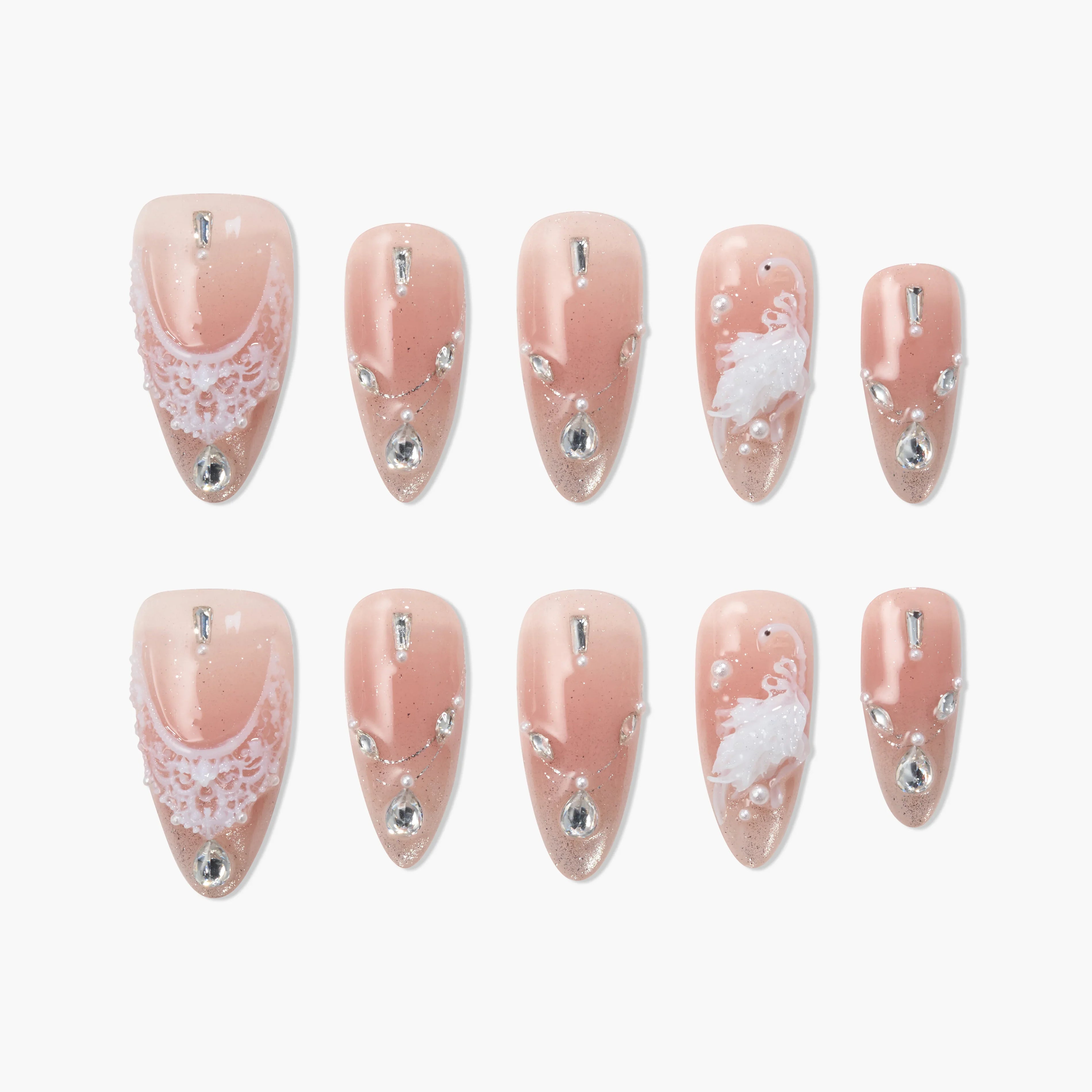 Handmade press-on nails in blush pink with lace, rhinestones, pearls, and 3D floral accents