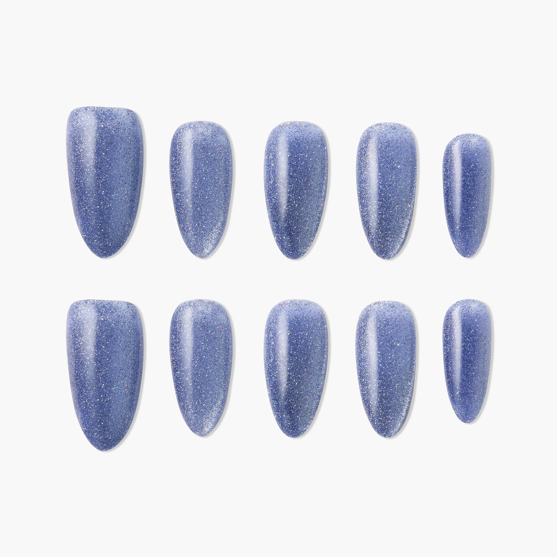 Set of oval blue glitter press-on nails arranged on a white background