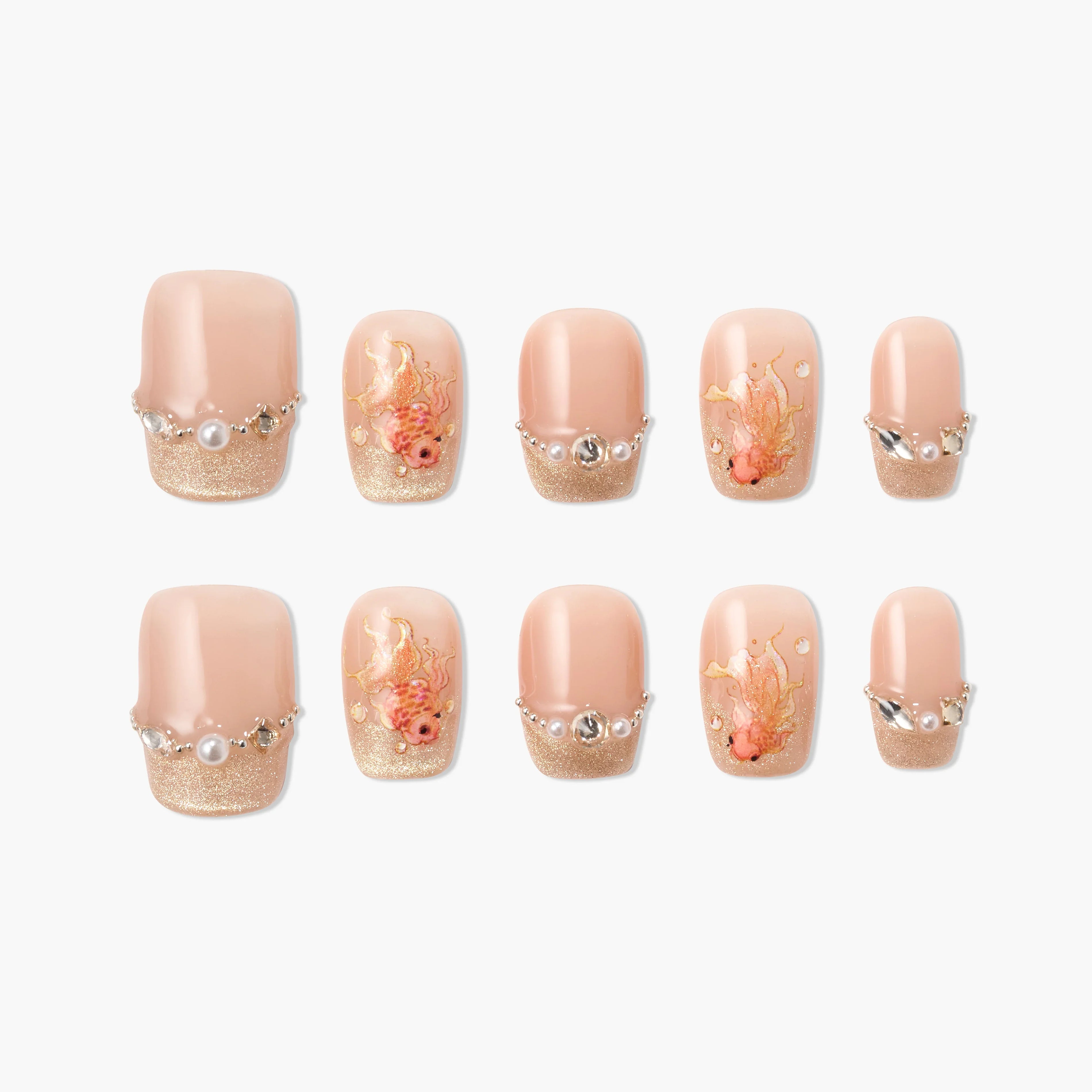 Handmade press-on nails with nude and gold glitter tips, pearl and crystal accents, and floral designs