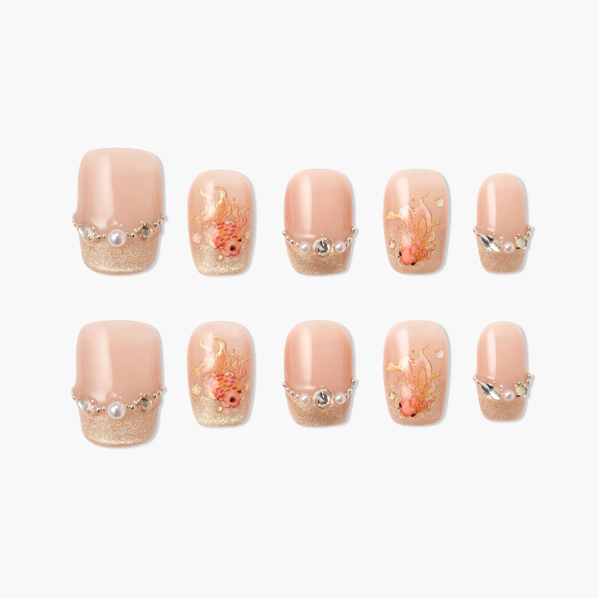 Handmade press-on nails with nude and gold glitter tips, pearl and crystal accents, and floral designs