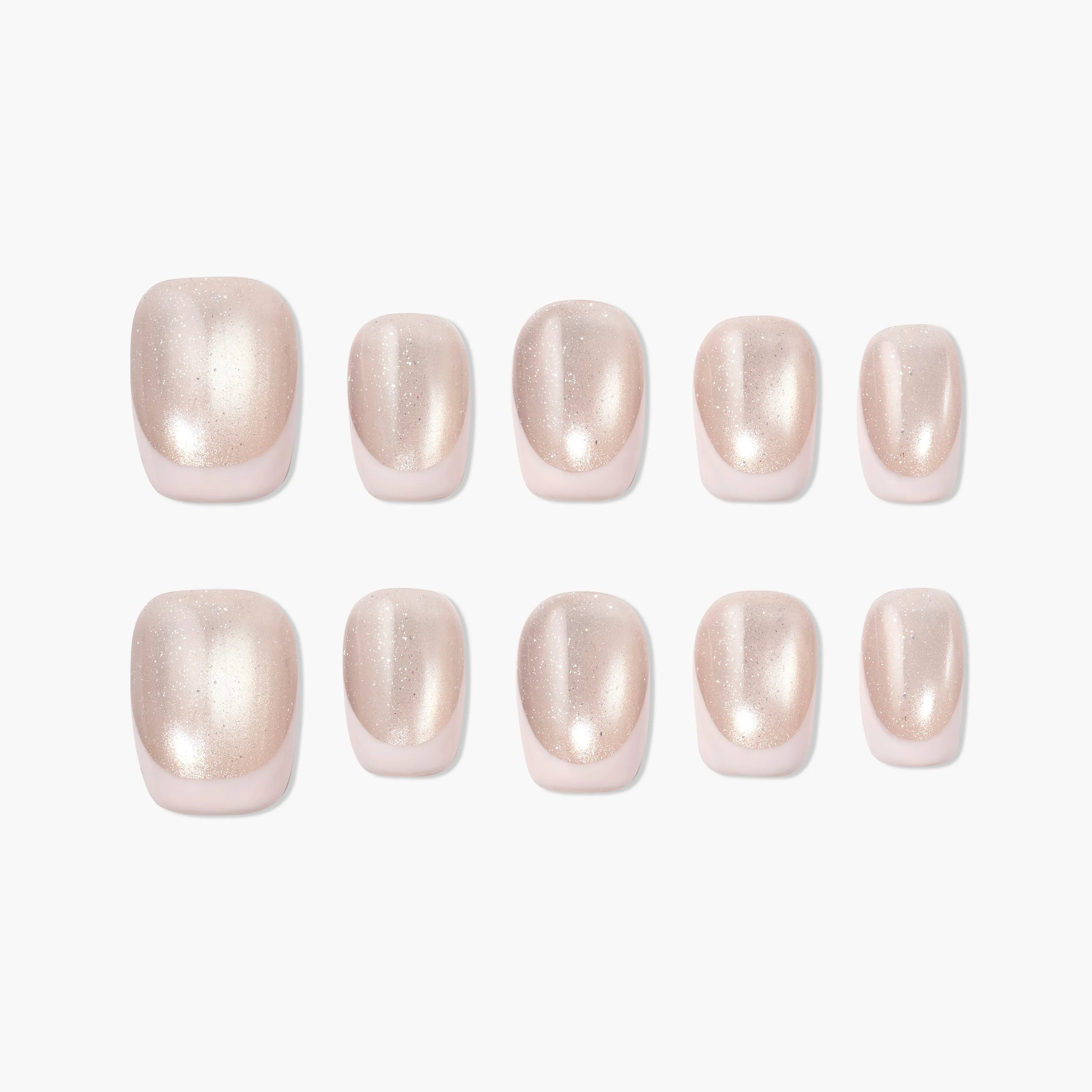 Set of glossy nude press-on nails with a subtle shimmer, arranged on white background