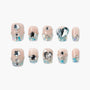 Handmade press-on nails with nude base, blue glitter, silver gems, heart and star accents