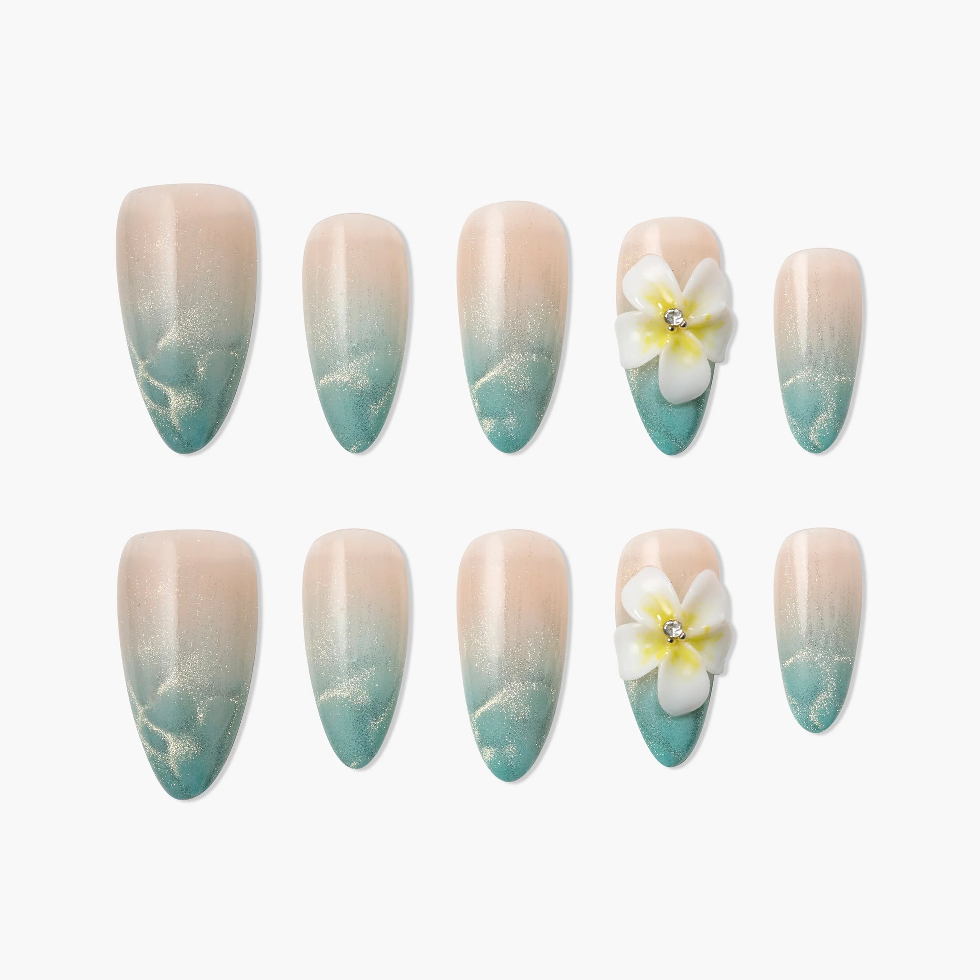 Ombre blue and nude press-on nails with 3D white flower accent and glitter