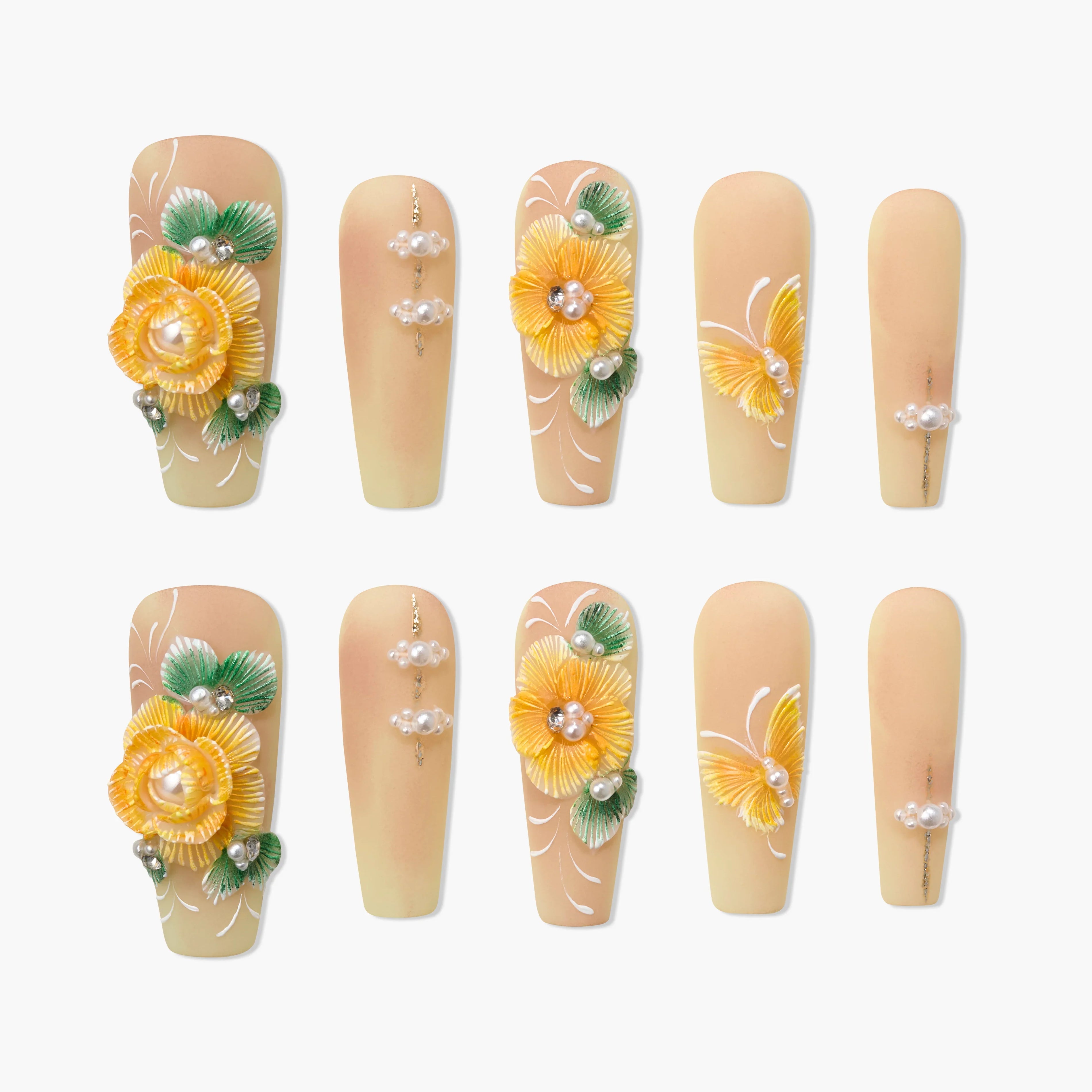 Handmade press-on nails with yellow 3D floral designs, pearls, and green leaf accents