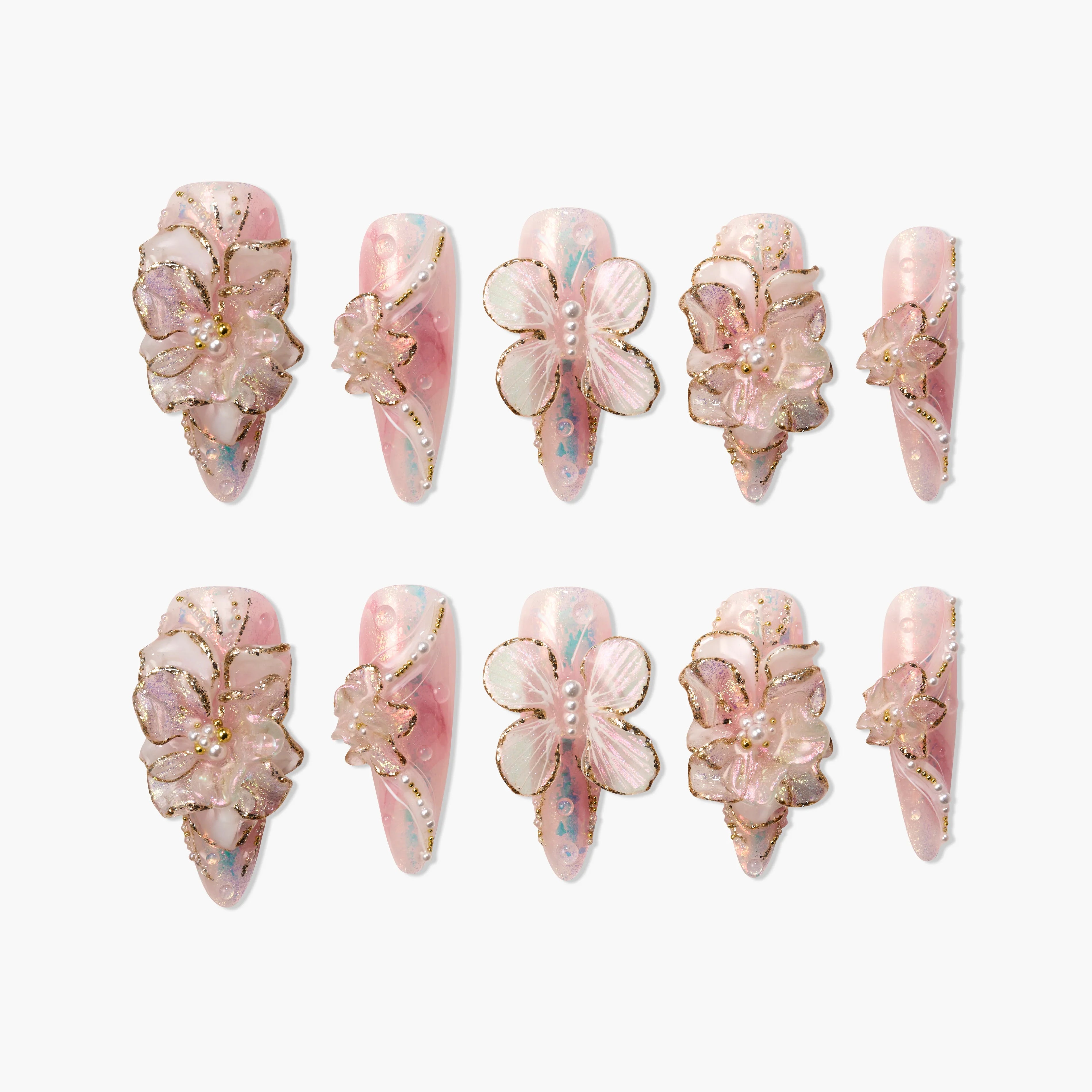 Handmade pink press-on nails with 3D flower and butterfly designs, gold accents, and pearl details