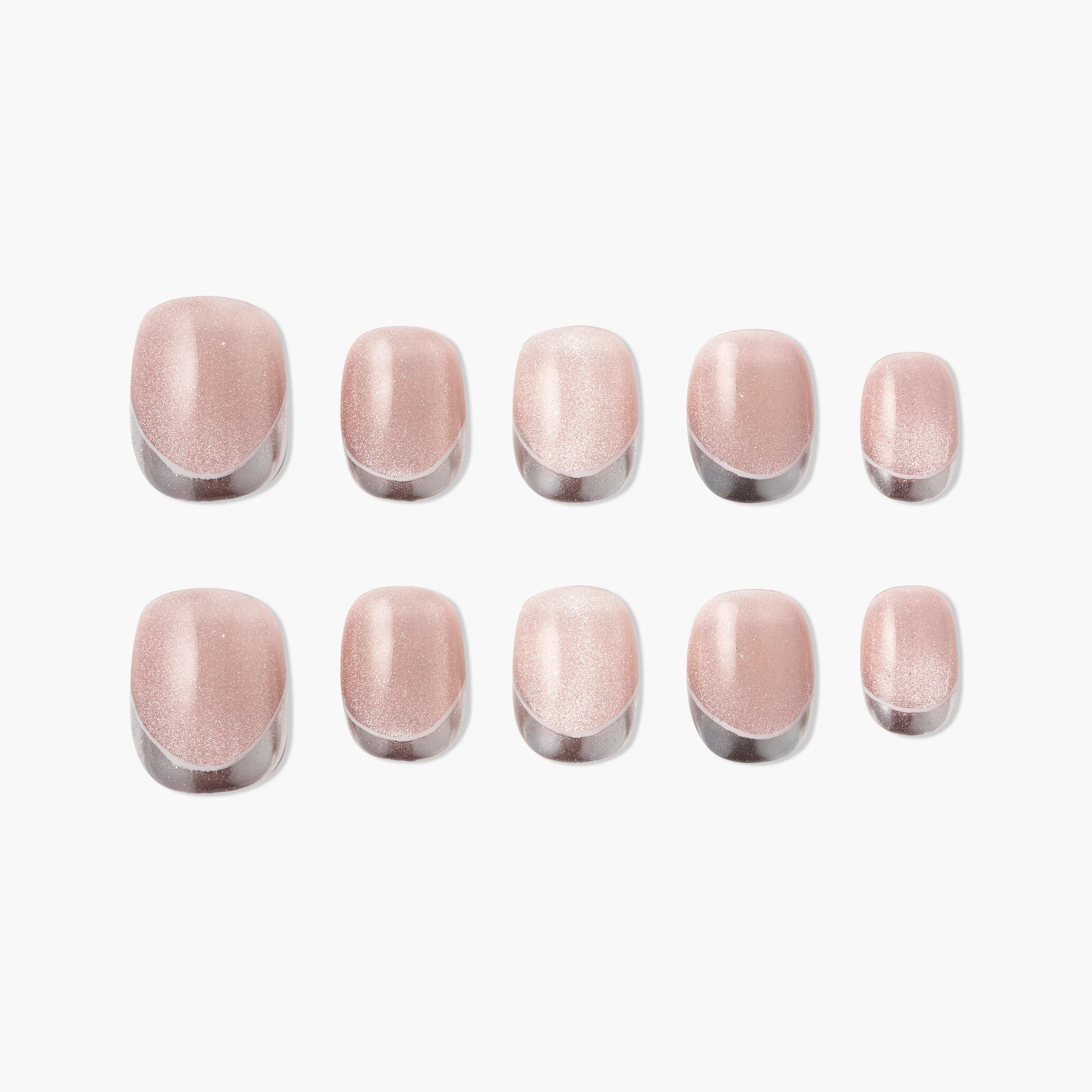 Set of glossy nude pink press-on nails with a subtle shimmer on a white background