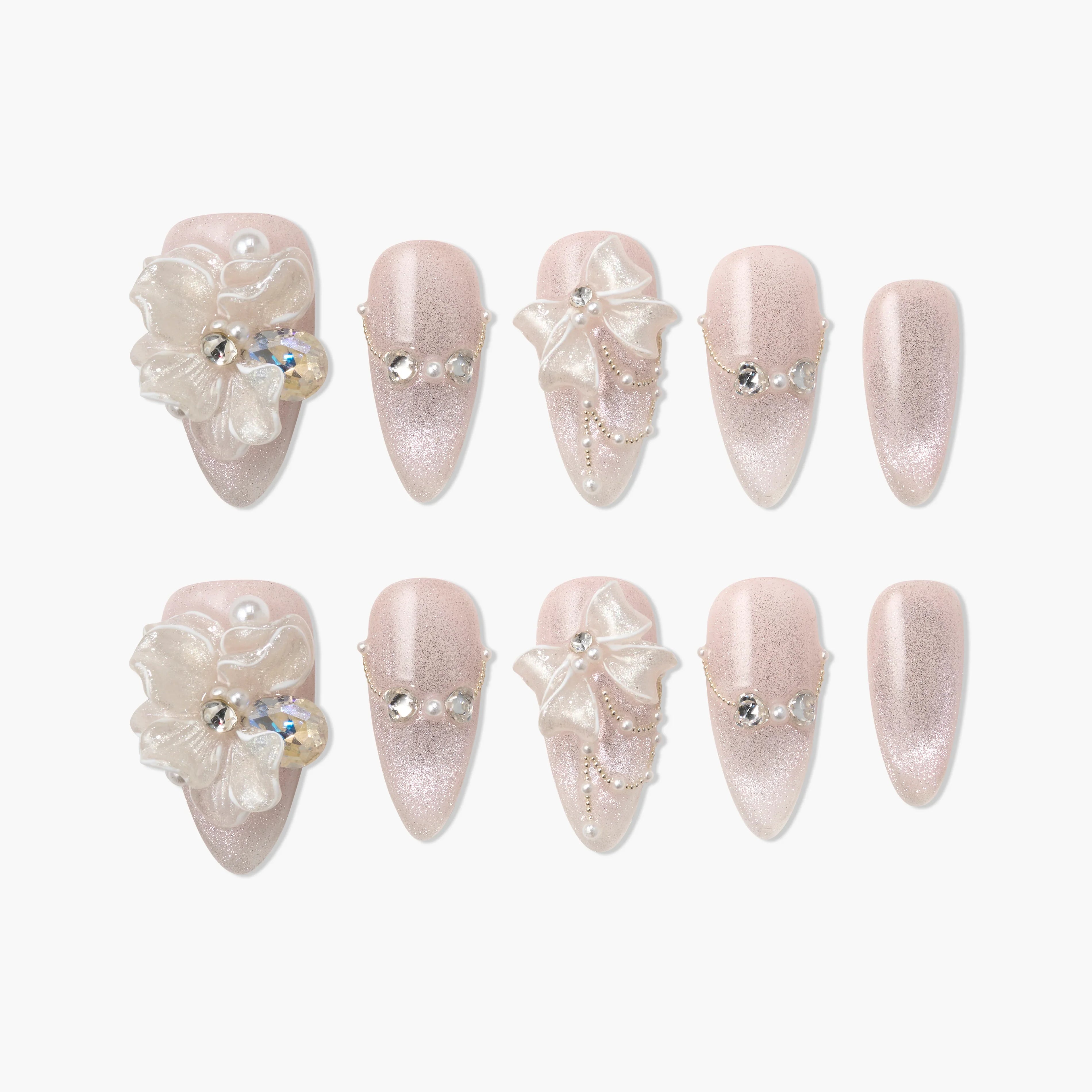 Pink glitter press-on nails with 3D floral and bow designs, pearls, and rhinestones accents.