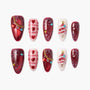 Christmas press-on nails set with red, white, and heart designs, snowflakes, gems, and 3D tree art