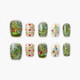 Handmade Christmas press-on nails with heart, snowflake, and decorated tree designs