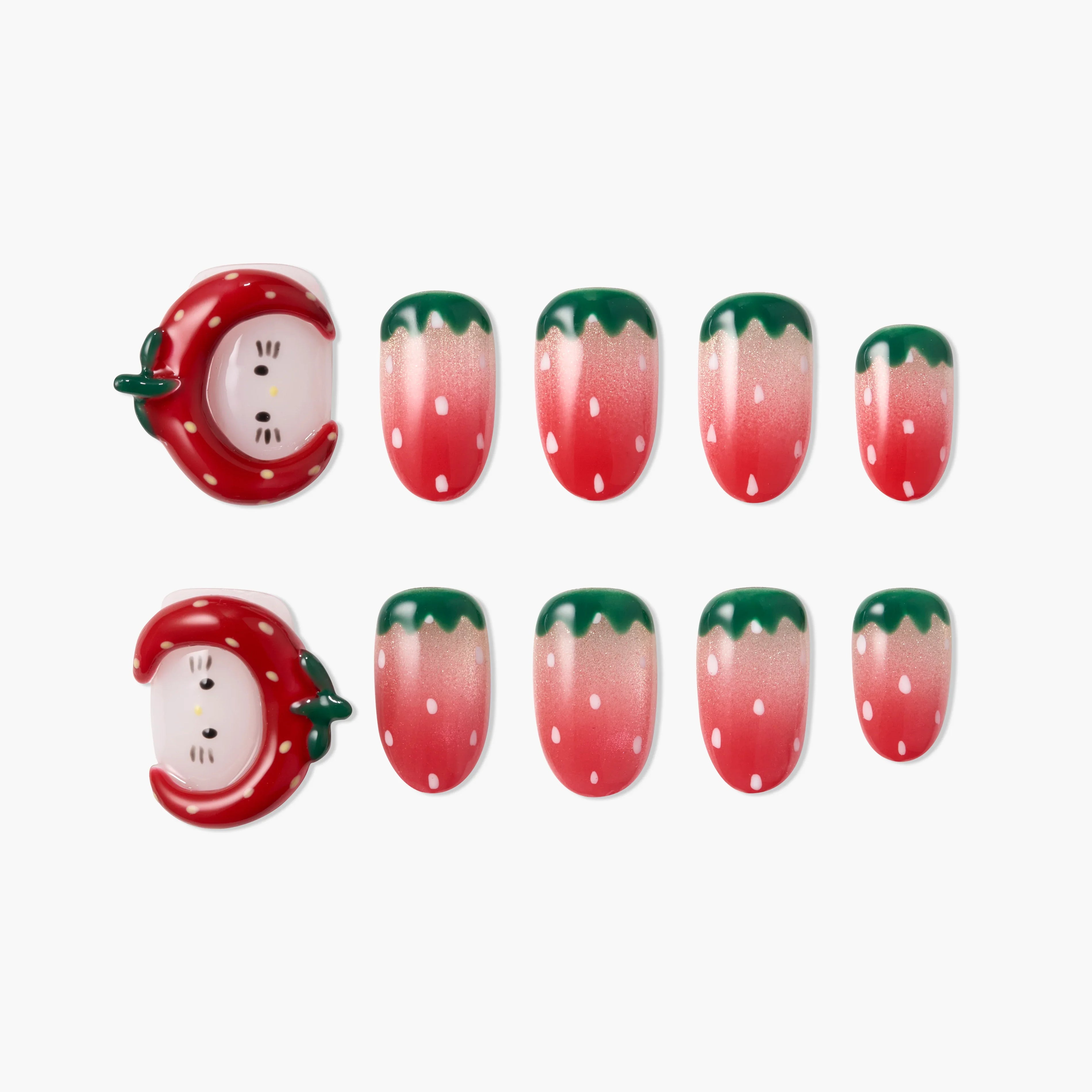 Strawberry-themed press-on nails with cute 3D strawberry face accents and pink ombré tips.