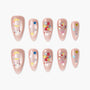 Handmade pink press-on nails with moon, stars, gems, butterfly and bow designs