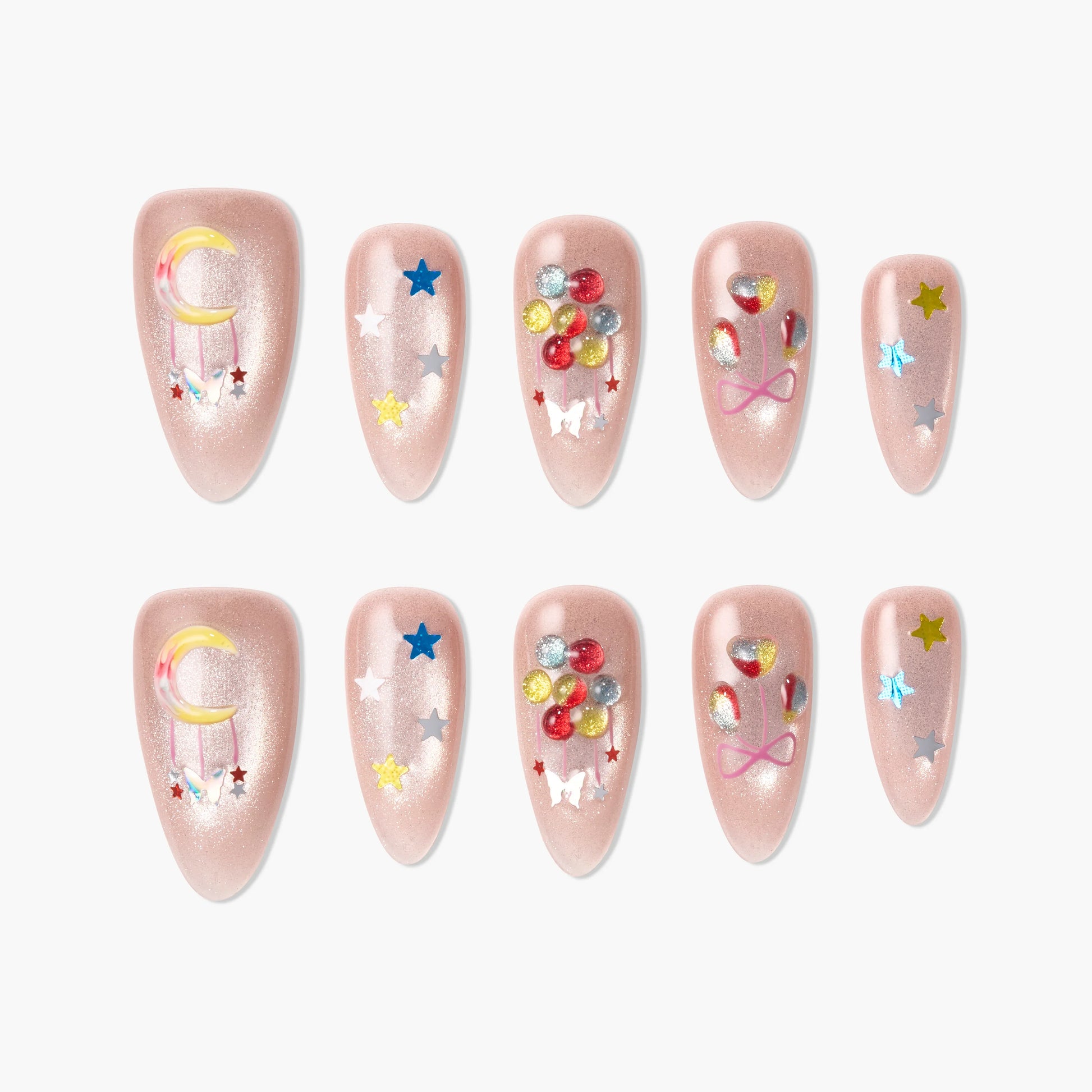 Handmade pink press-on nails with moon, stars, gems, butterfly and bow designs