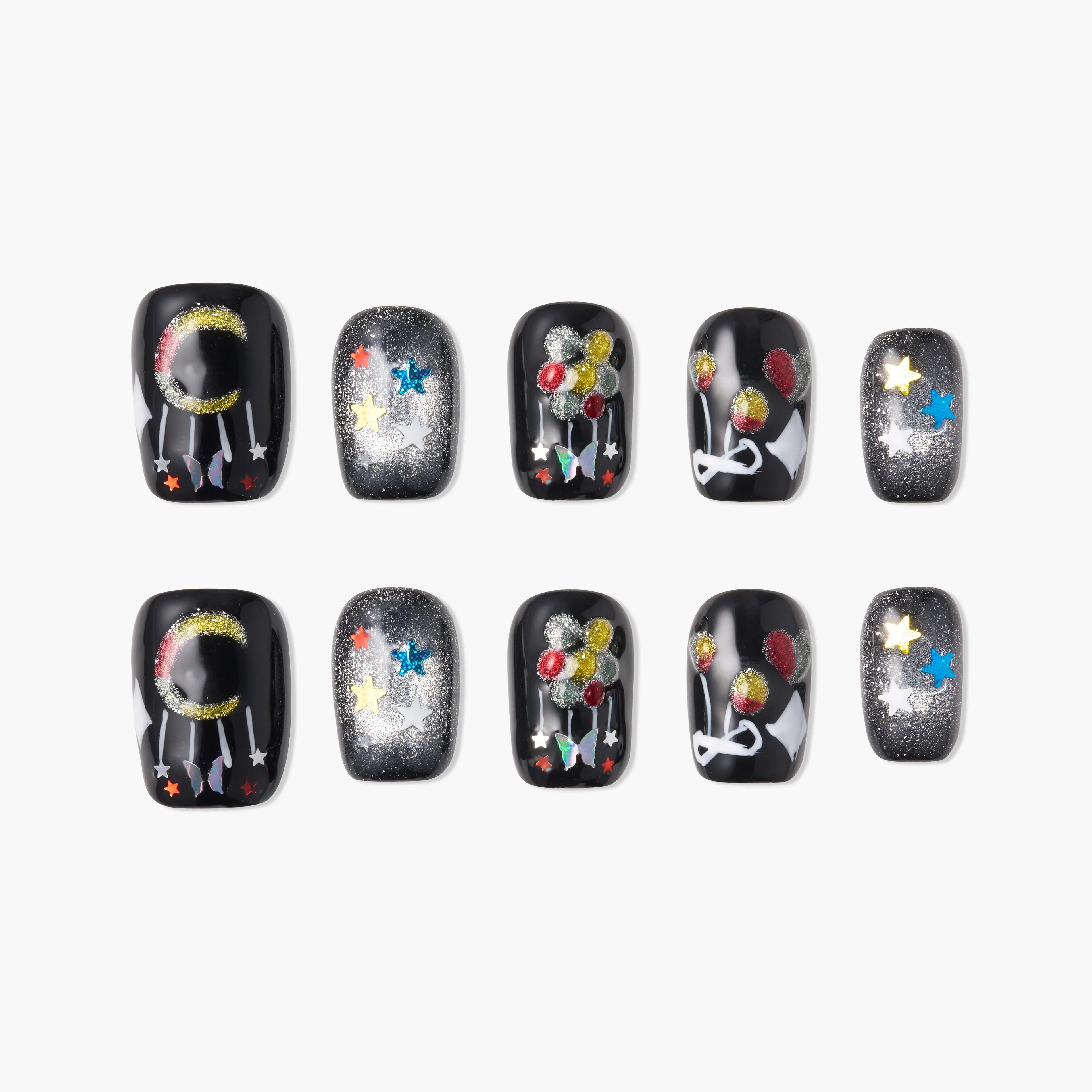 Black press-on nails with glitter moon, stars, and balloon designs, festive and colorful