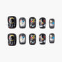 Black press-on nails with glitter moon, stars, and balloon designs, festive and colorful