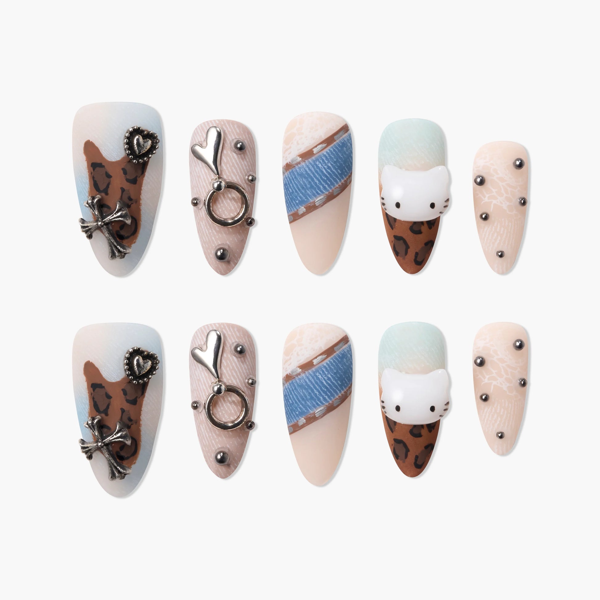 Handmade press-on nails with leopard print, metallic charms, denim accents, and cat face designs