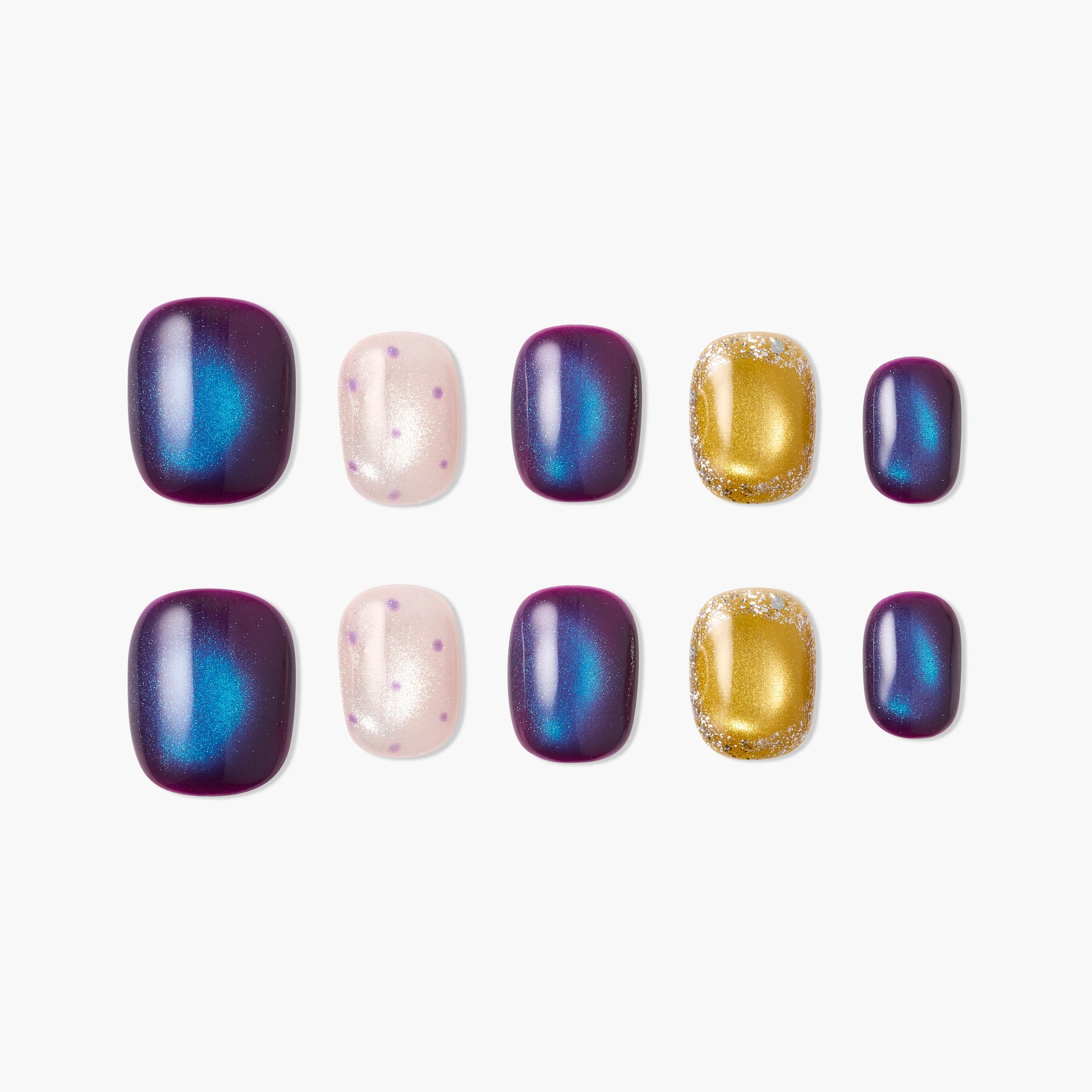 Handmade press-on nails in purple, blue, gold glitter, and pink with polka dot designs