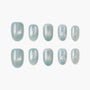 Mint green press-on nails with silver accents and pearl embellishments, set of ten