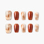Handmade press-on nails set with marble and plaid designs in brown and beige tones, on white background.