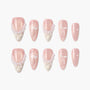 Pink and ivory press-on nails with 3D ruffle, pearl accents, and white bow nail art design.