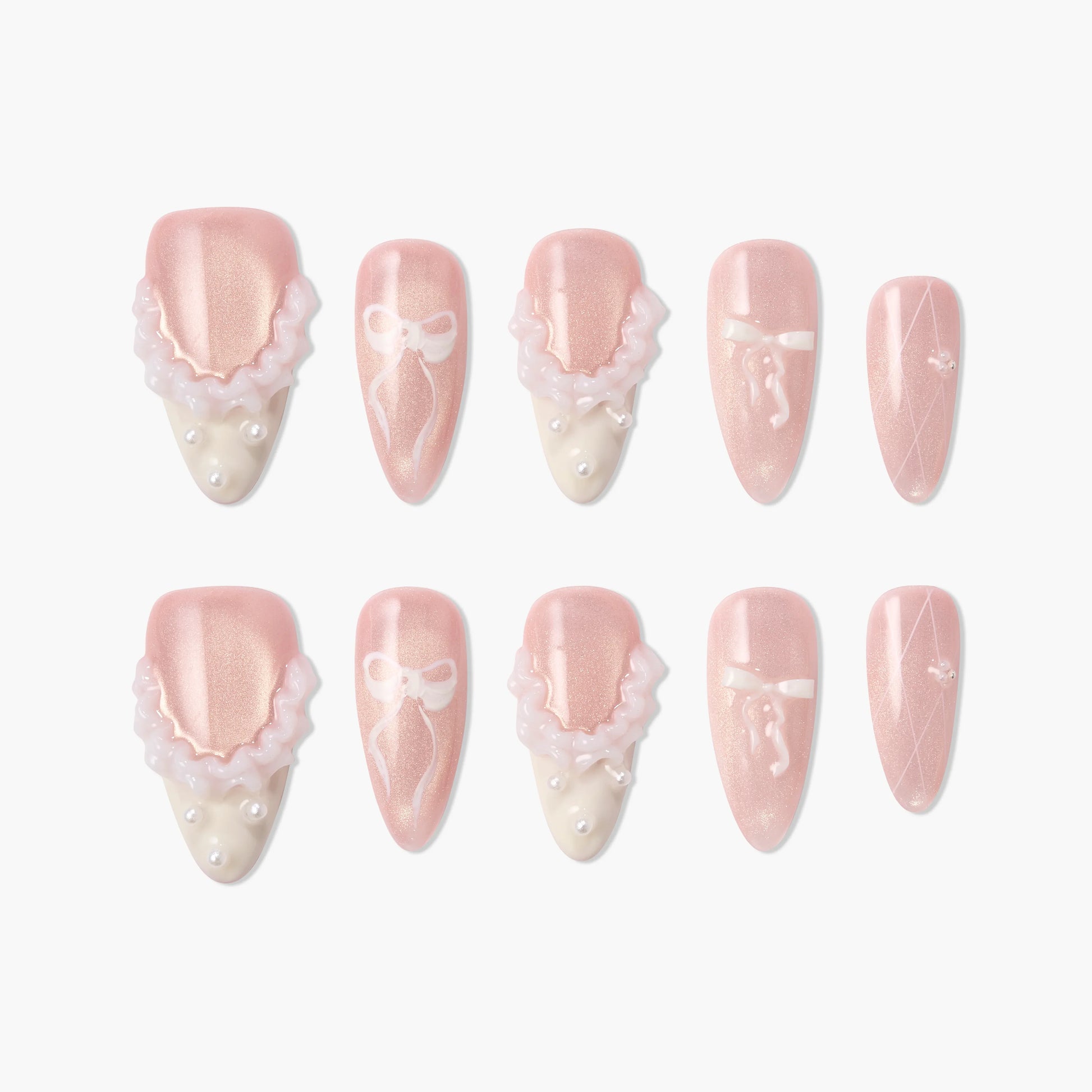Pink and ivory press-on nails with 3D ruffle, pearl accents, and white bow nail art design.