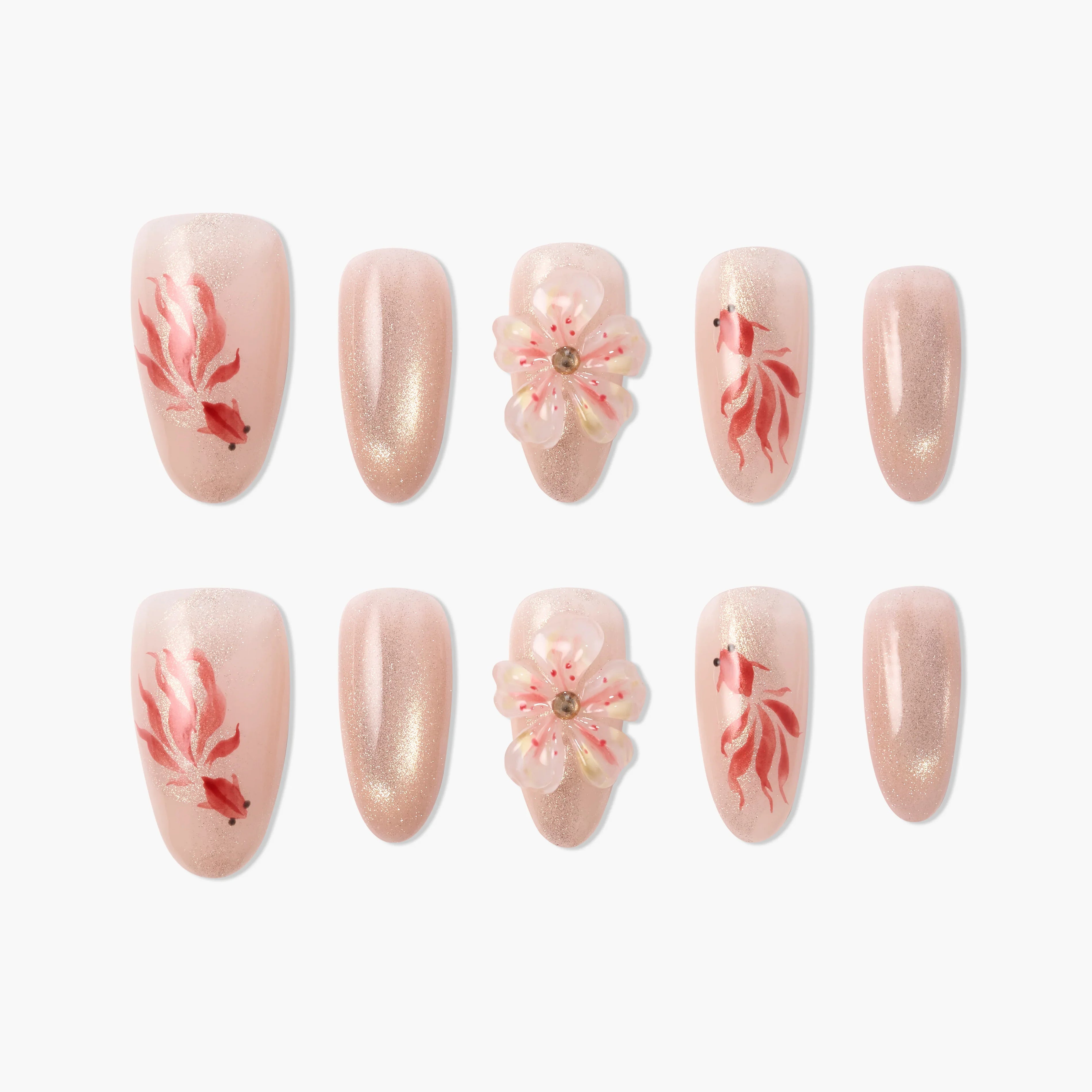 Handmade pink press-on nails with goldfish, glitter, and 3D floral designs arranged on white background