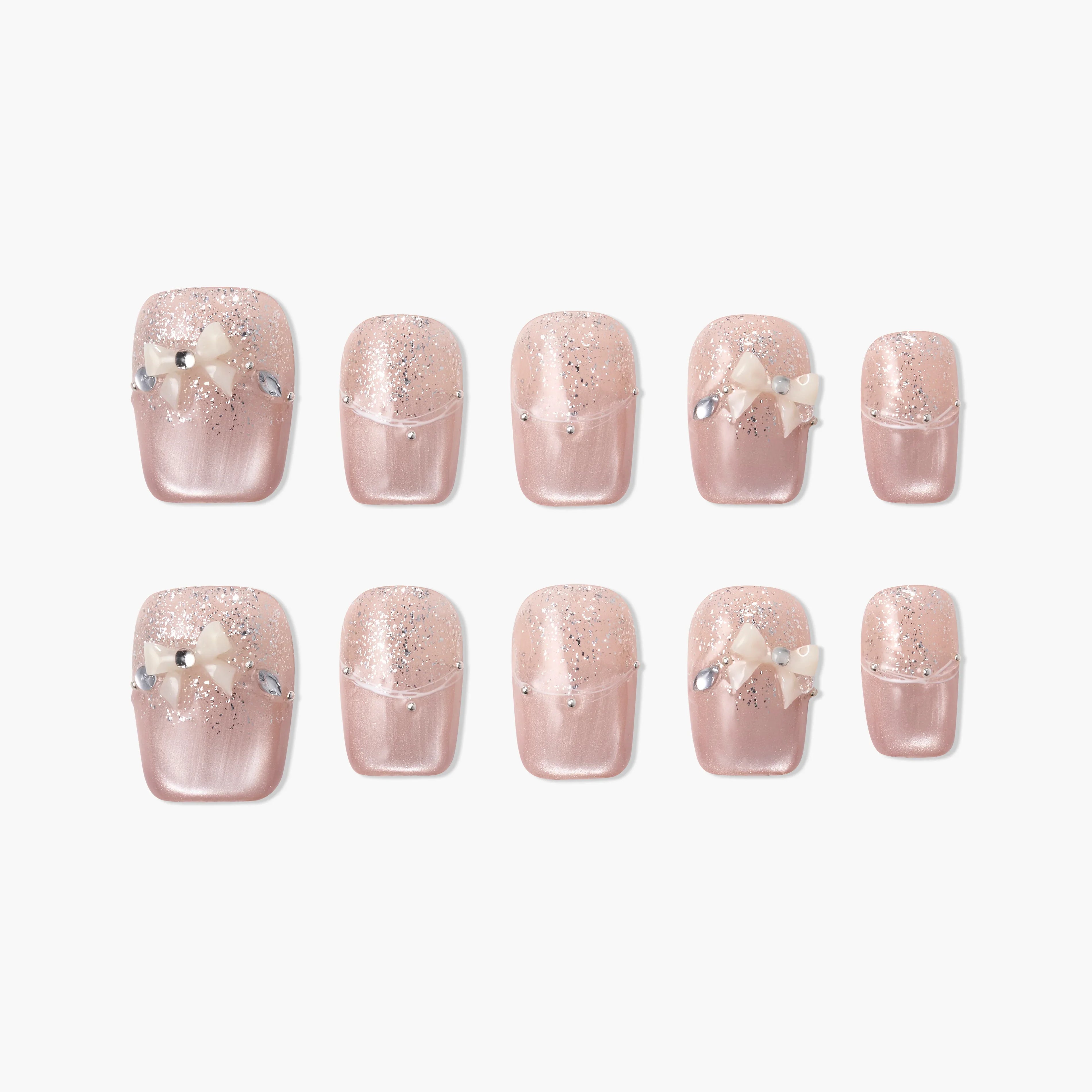 Handmade pink press-on nails with glitter, pearl bows, and rhinestone accents