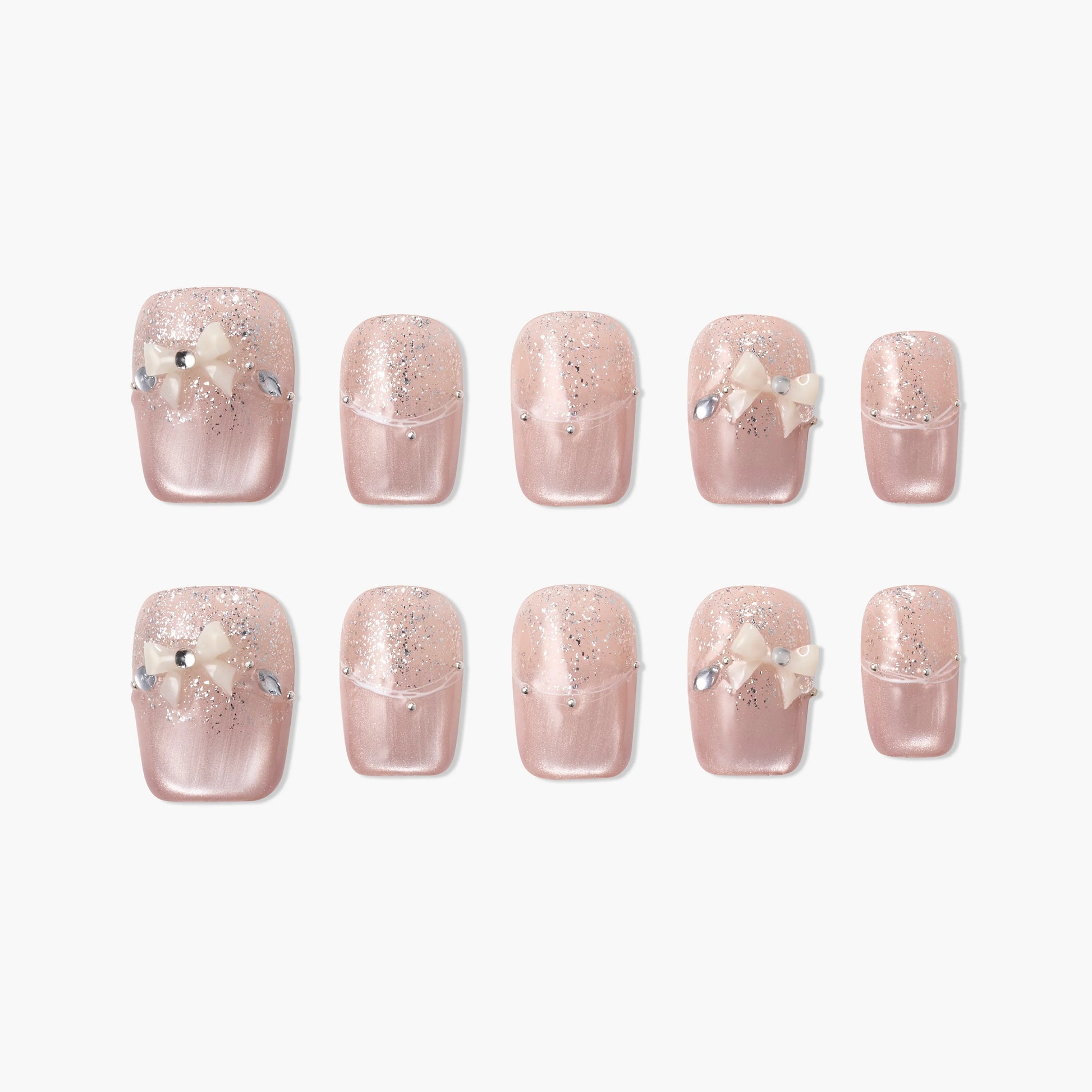 Handmade pink press-on nails with glitter, pearl bows, and rhinestone accents
