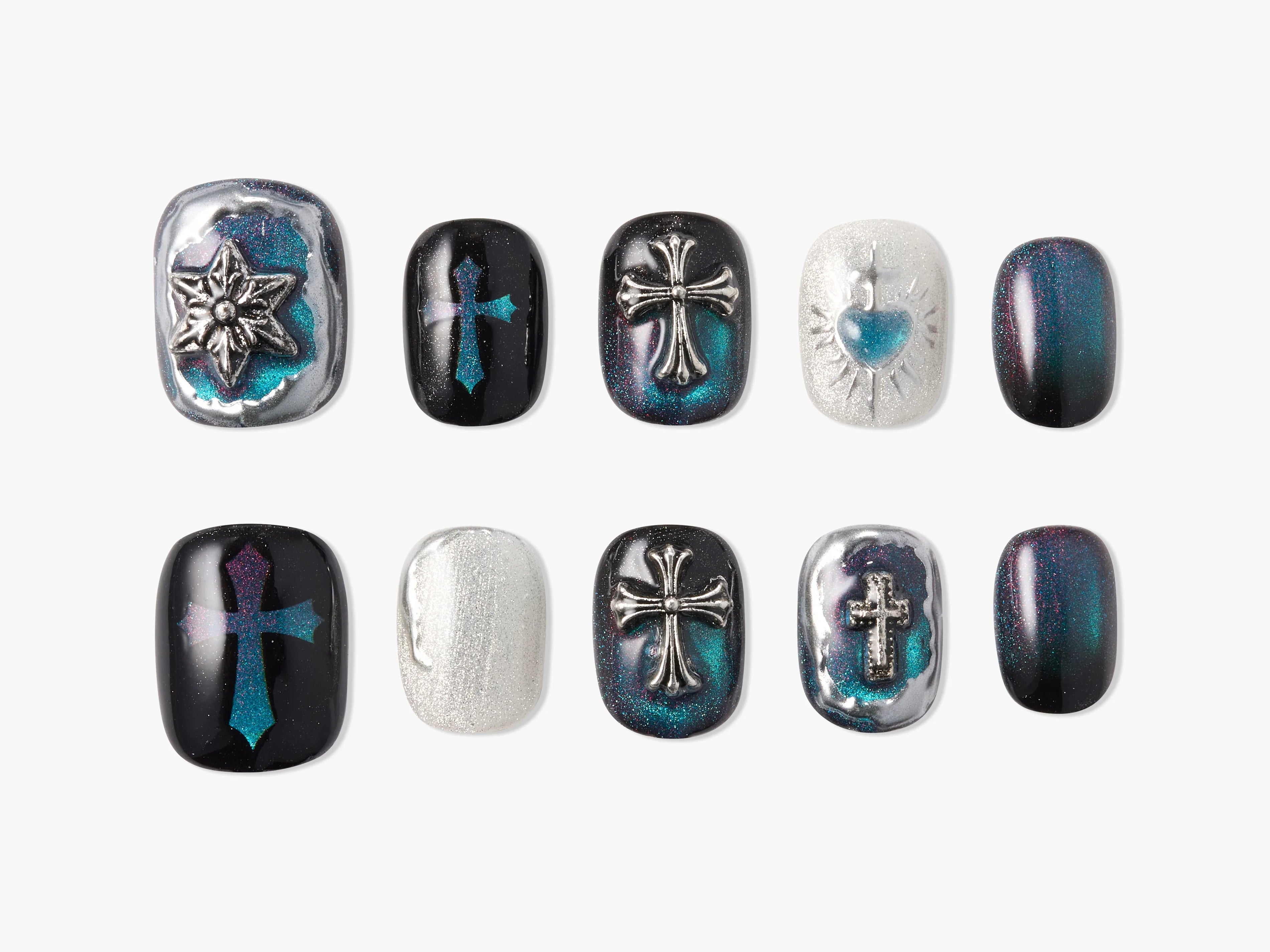 Handmade press-on nails with metallic cross and heart designs in black, teal, and silver tones.